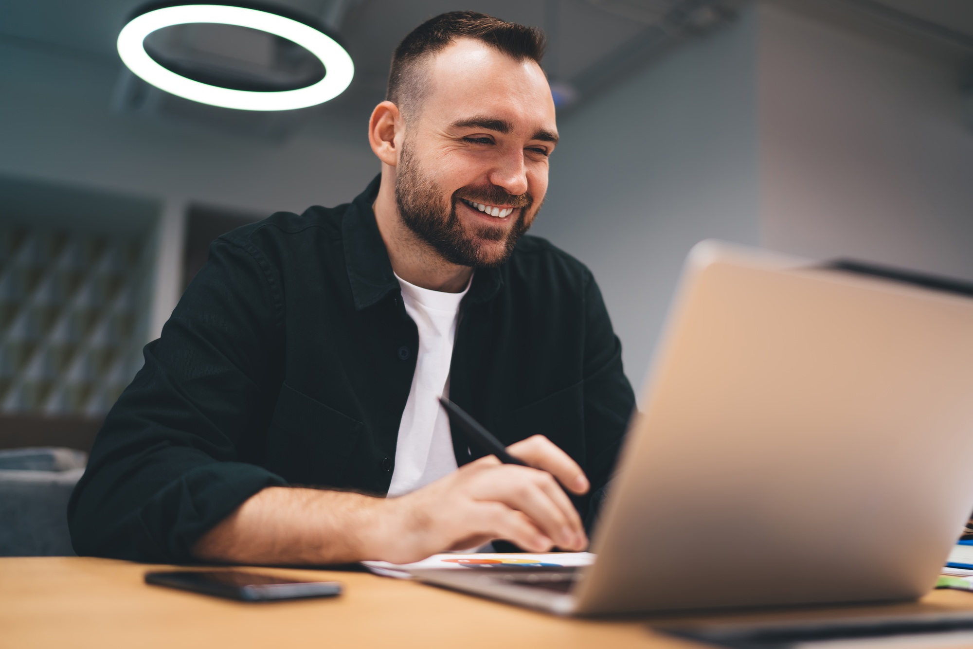 Cheerful freelancer having video call on laptop